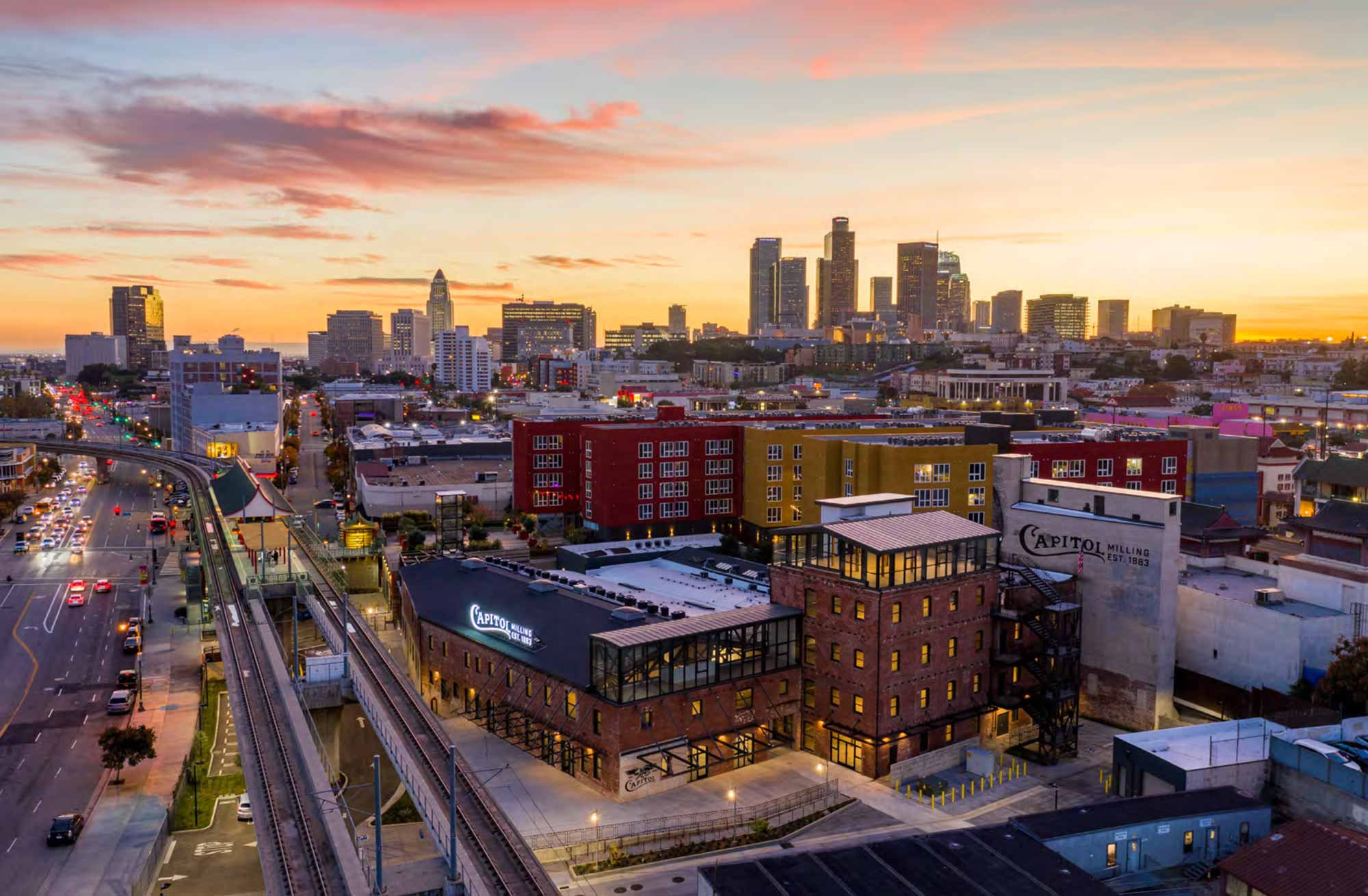 arial view of the Fiestic office at the Capital Milling complex with Downtown Los Angels in the background.